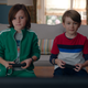 Billy and Tommy playing a video game.